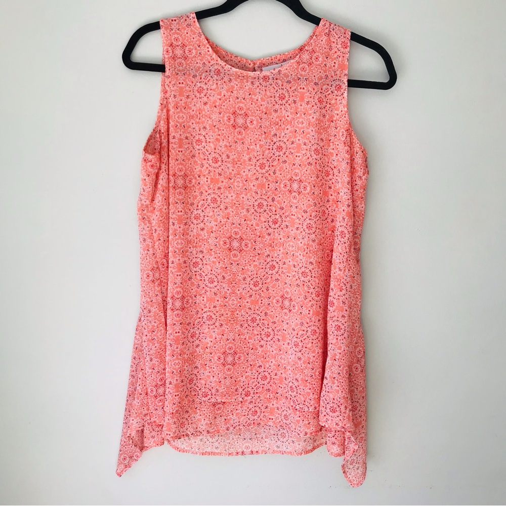 Short sleeve top,orange blue and white 100% polyester Front/back lined. Small